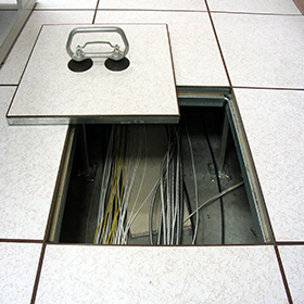 Raised access floor by Zau Interiors, used to improve the airflow and accessibility of an office
